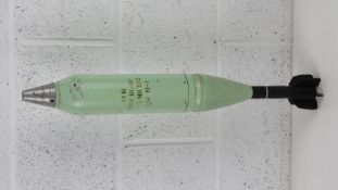An inert 81mm mortar illumination round (light green), 64cm in length.