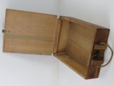 A WWII German 8cm wooden ammunition box, having stencilling on the box and rope strap.