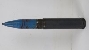 An inert Mauser 22 x 145 BK27 round approx 15cm in length.