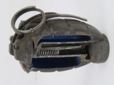 An inert cutaway No. 5 Mills Grenade.