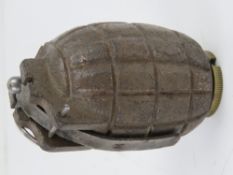 An inert No.5 Mills Grenade.