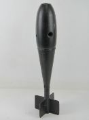 An inert British 20kg bomb with markings on the head W D.