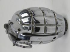An inert chromed No.36 Mills Grenade.