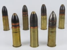 A quantity of inert assorted pom pom rounds each approx 15-16cm in height. Seven items.