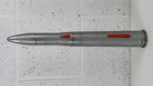 An inert 40mm Bofors inspection round, 45cm in length.