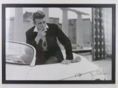 A contemporary photographic print of James Dean having facsimile signature upon,