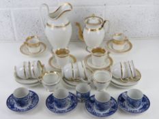 A set of four Noritake blue and white phoenix design coffee cans and saucers,