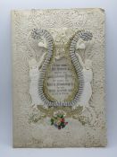 A decoupage Sweetheart or Valentines card having central Lyre design over paperlace 'I do this