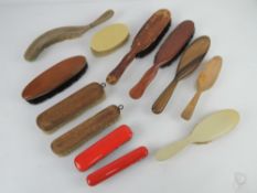 Twelve assorted vintage clothes brushes, crumb brush, etc.