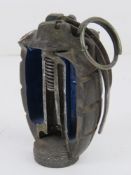An inert cutaway No. 5 Mills Grenade.