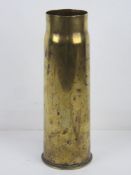 A WWI 1918 brass shell case standing 29.