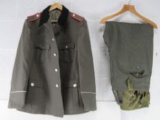 A Post War East German tunic, a pair of