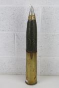 An inert WWII 25pdr shell and case standing 66.5cm high dated 1942 having broad arrow