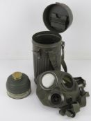 A WWII German AUER gas mask with filter