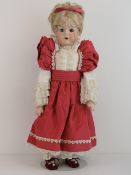 A handmade 20th century bisque headed do