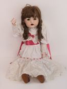 A handmade 20th century bisque headed do