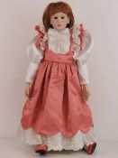 A handmade 20th century bisque headed do