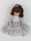 A handmade 20th century bisque headed do