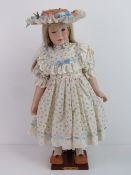 A handmade 20th century bisque headed do