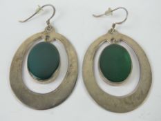 A pair of large green stone and silver earrings, stamped 925, drop from top of hook 5.5cm in length.