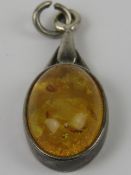 A silver and Baltic amber pendant, stamped 925 and measuring 2.7cm inc bale.