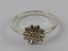 A contemporary floral ring, stamped 925, size P-Q.