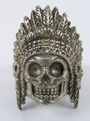 A white metal ring having skull in Native American style Chieftain feathered head dress,