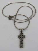 A silver Celtic style cross pendant, stamped 925, 3.3cm inc bale, on silver chain.