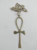 A large ankh pendant having Arabic hallmark upon, 8.2cm in length, on substantial silver chain.