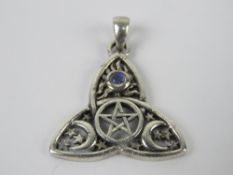 A silver Wiccan pentagram, crescent and moonstone pendant, stamped 925 and measuring 2.7cm wide.