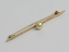 An Edwardian gold and pearl bar brooch, stamped 9ct? indistinct, 5.7cm wide, 2.