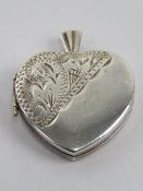 A silver heart shaped locket having unusual trinket / momory box within, stamped silver, approx 2.