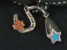 Links of London; two silver and enamel charms having Links hallmark upon in the form of a lucky hor