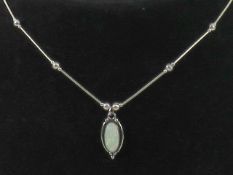 A 925 silver and opal pendant on Native American style bead chain necklace, stamped 925 to pendant.