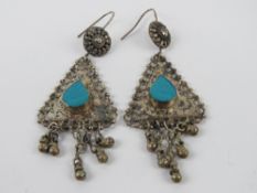 A pair of large silver earrings having central turquoise coloured teardrop panel, stamped 925, 8.
