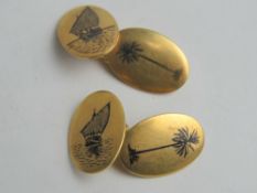 A pair of yellow metal neillo cufflinks having Arabic marks to back,