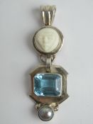 A 925 silver pendant having carved white hardstone over blue stone and pearl, 5cm in length.