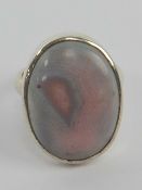 An unusual pink and lilac stone cabachon ring, stamped 925, size N.