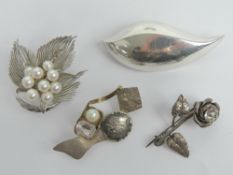 A sterling silver and pearl floral brooch together with a HM silver floral brooch and two 925