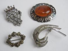 A baltic Amber brooch stamped 925, together with a sterling silver and marcasite wreath brooch and