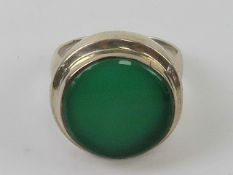 A silver and green onyx cocktail ring, circular form, stamped 925, size Q.