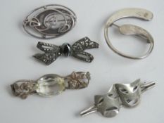 A HM silver brooch in abstract design, together with two brooches stamped 935 in the form of theatre