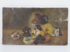 Oil on canvas; pansies before a stoneware jug, signed lower right A. Drew, a/f, 35.5 x 20.5cm.