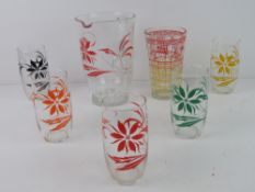 A c1970s lemonade set comprising jug and five glasses.