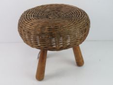 A wicker footstool.