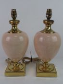 A pair of ceramic and brass baluster style table lamps.