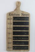 A contemporary kitchen chalk board 'kitchen notes' sign.