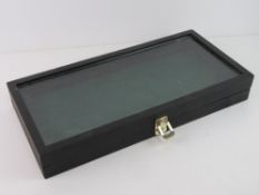 A glazed display box, 52 x 25cm.