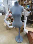 A vintage blue fabric, jointed arm and hands, tailors mannequin.