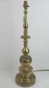 A large and heavy brass table lamp of column form.